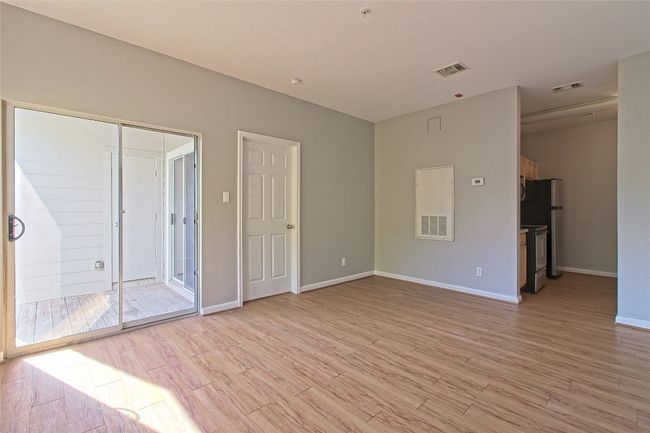 Spare room with light wood-type flooring | Image 14