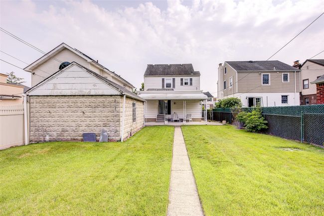 Back of property featuring a patio area and a fenced backyard | Image 45