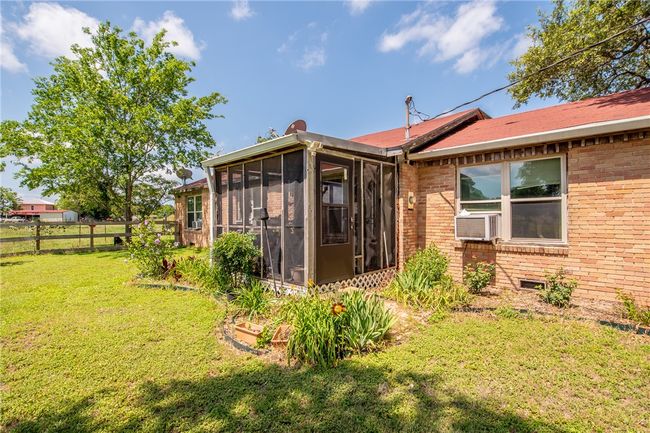 Back of house with a sunroom and brick siding | Image 11
