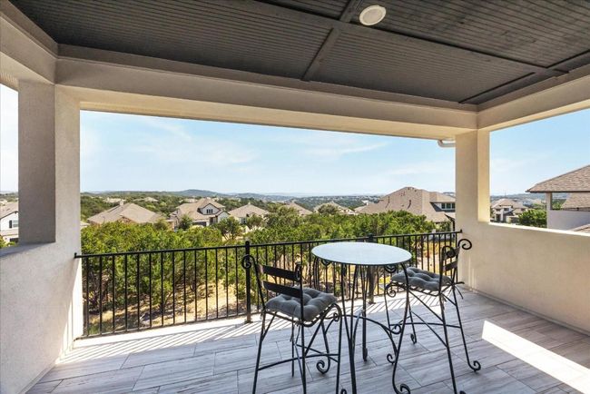 The upper balcony offers stunning canyon views and, when the lake is higher, a direct line of sight out to beautiful Lake Travis! No neighbors directly behind the home. | Image 25