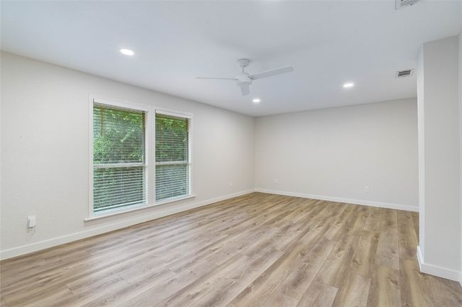 Spare room featuring visible vents, ceiling fan, light wood-style flooring, and recessed lighting | Image 30