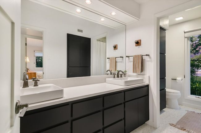 Spacious hall bathroom with double sinks | Image 20
