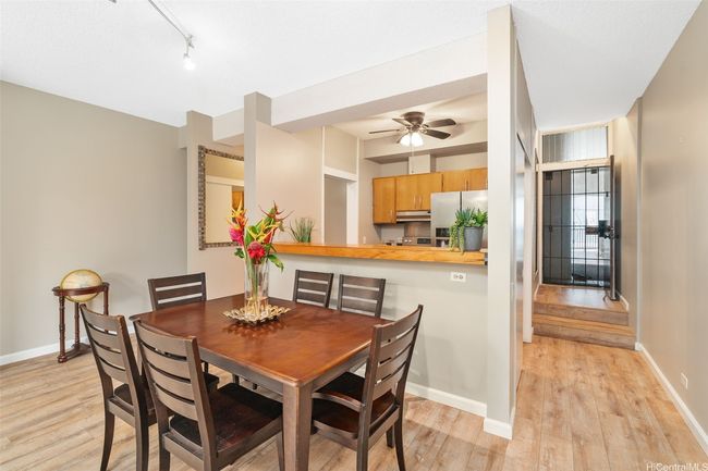 Dining area looking back towards the kitchen and entry to the right. | Image 6