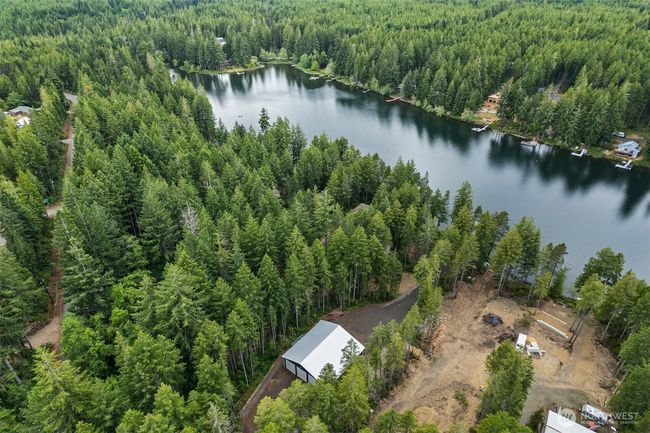 A portion of Tee Lake with a view of the property. This property also has gorgeous view of the Olympic Mountains on those clear days. | Image 33