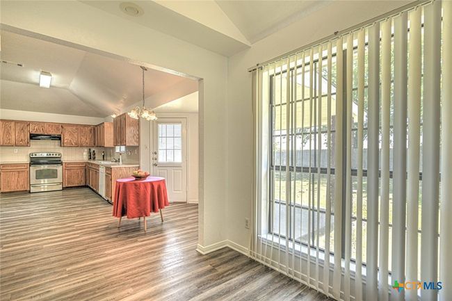 Natural lighting in formal dining and kitchen | Image 13