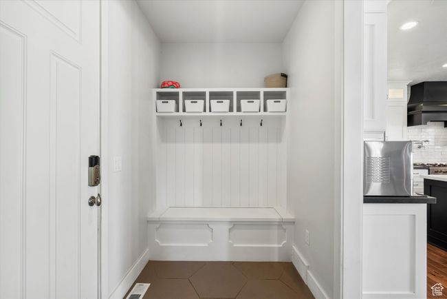 Mudroom featuring recessed lighting, visible vents, baseboards, and dark tile patterned flooring | Image 21