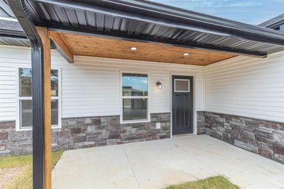 Doorway to property with a patio area | Image 2