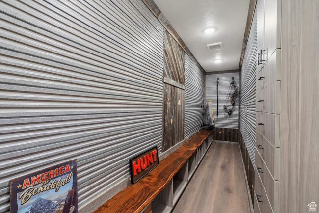 Corridor with visible vents and wood finished floors | Image 43