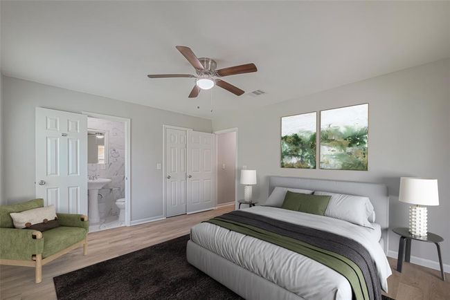 This restful primary bedroom has an en suite bath, ceiling fan, and ample room to personalize with your favorite furnishings. *virtually staged* | Image 16
