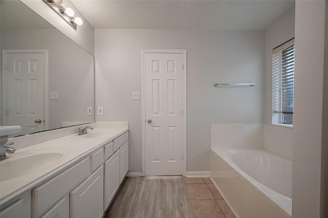 Primary bathroom with dual vanity and soaker tub | Image 22