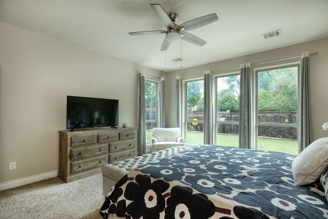 Another view of the primary suite with natural light flooding in. | Image 12
