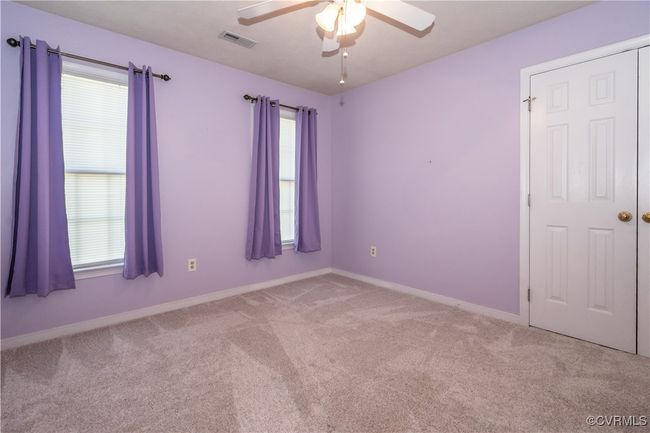 Unfurnished room featuring a ceiling fan and light carpet | Image 14
