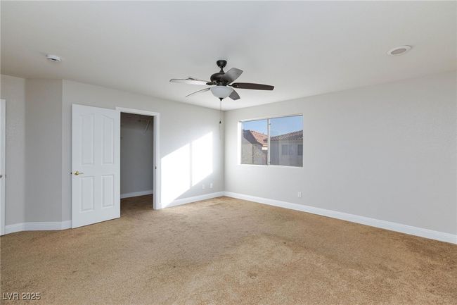 Empty room with ceiling fan, carpet flooring, and baseboards | Image 26