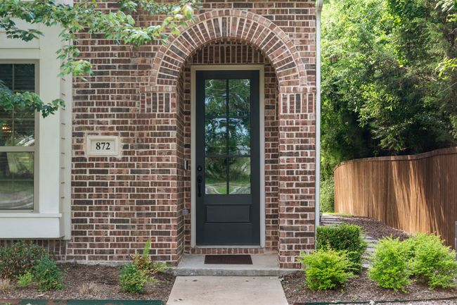 View of exterior entry with brick siding | Image 4