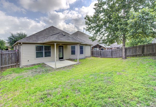 Back of house featuring a patio, a fenced backyard, and roof with shingles | Image 24