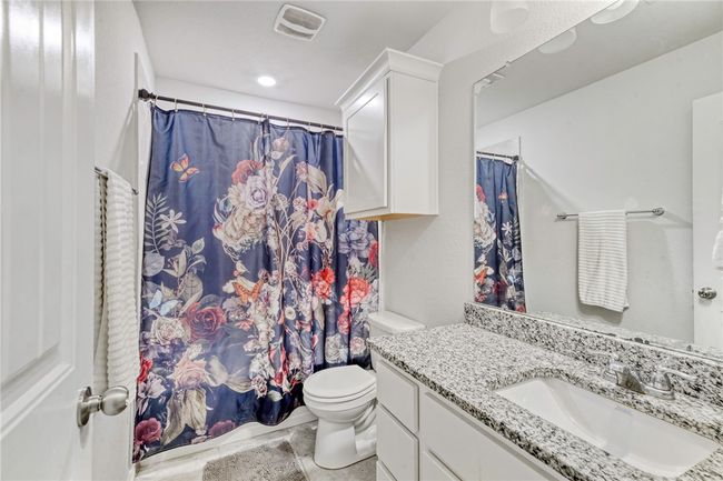 Bathroom featuring vanity and toilet | Image 30