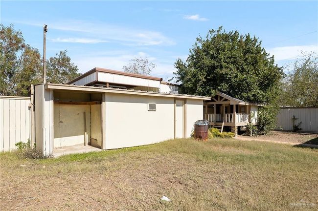 Back of property with a lawn | Image 19