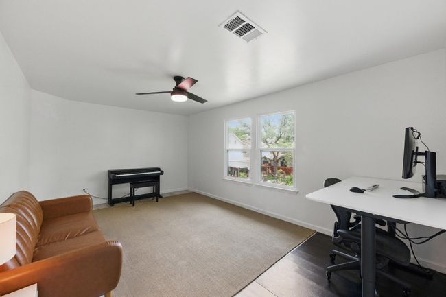 The large game room provides endless possibilities, perfect for recreation, movie nights, or a home office setup. | Image 20