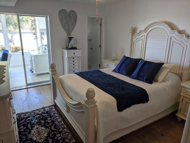 Master bedroom with direct access to sunroom | Image 11