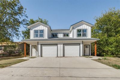 View of front of property featuring a garage | Image 1