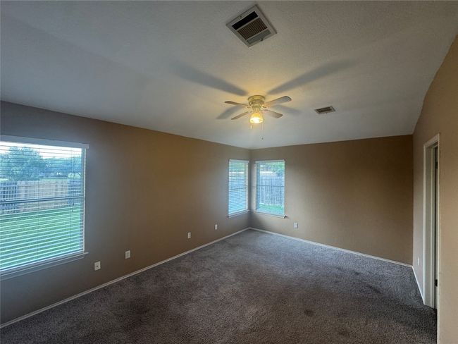 Empty room featuring carpet and ceiling fan | Image 6