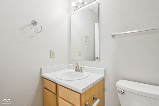 bathroom featuring vanity and toilet | Image 32