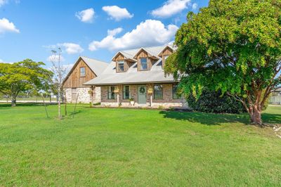 View of front facade with a front yard | Image 2