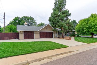 Located on a huge corner lot, this home has a ton of upgrades that include, a new renovated custom kitchen at a cost of over $50k, designer baths, newer windows, newer roof, Hi efficient furnace, new water heater and huge 970 Square foot heated 3 car garage. | Image 2