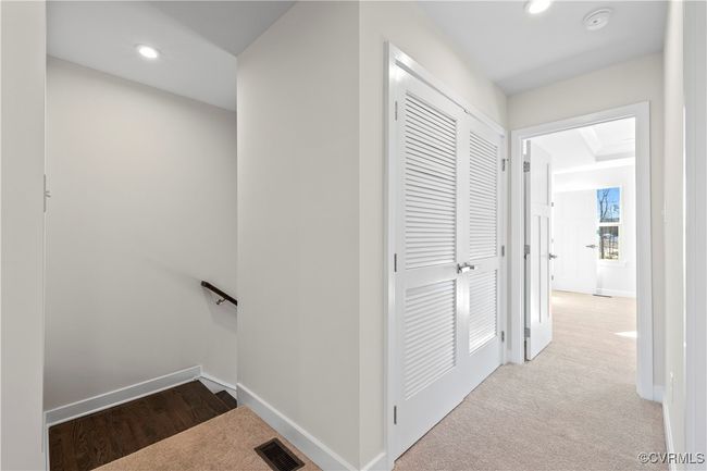 Corridor featuring carpet flooring, visible vents, baseboards, and recessed lighting | Image 14