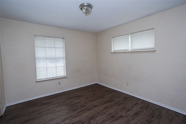 Bedroom 2 featuring wood finished floors and baseboards | Image 14