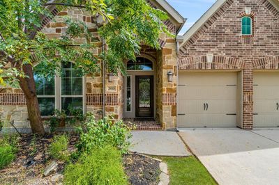 The inviting entryway welcomes you with its elegant design and charming details, setting the tone for the warmth and comfort found throughout the home | Image 2