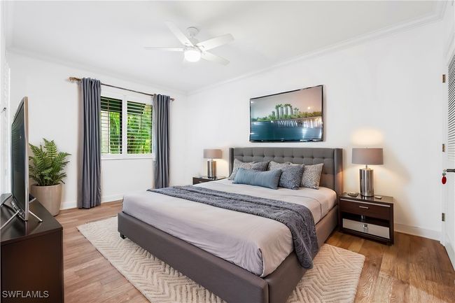 Virtually Stage: Primary Bedroom featuring crown molding, light hardwood / wood-style floors, and ceiling fan | Image 6