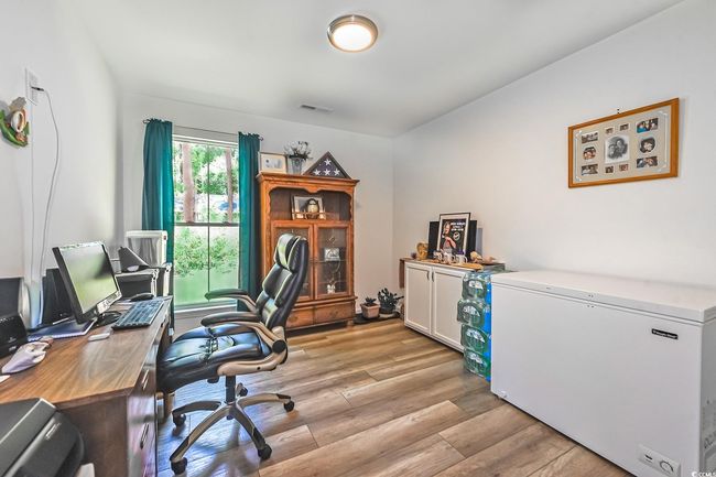 Office area featuring light wood-type flooring | Image 11