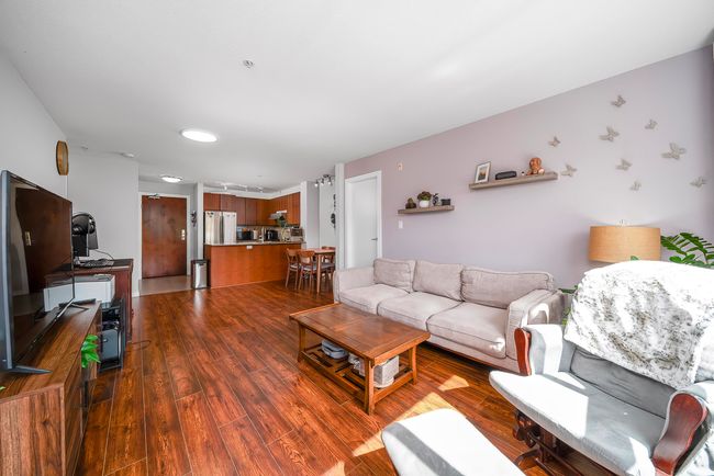 Living room featuring dark wood-style floors | Image 9