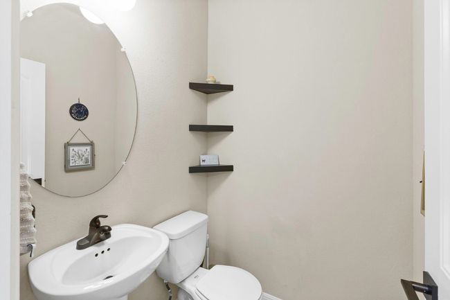 1/2 bath in hallway next to office | Image 4