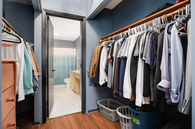 Walkthrough closet conveniently located between primary bedroom and full bath | Image 23