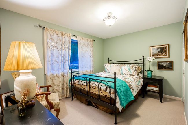 Carpeted bedroom with baseboards | Image 16