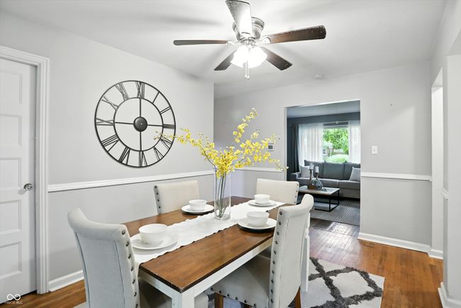 dining room with a ceiling fan and wood finished floors | Image 12