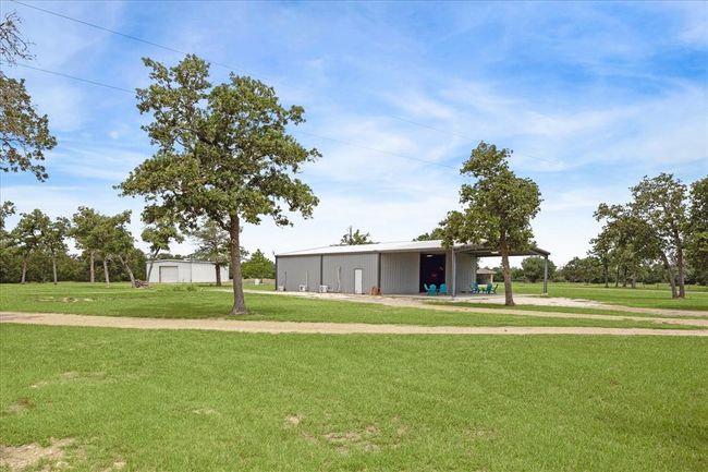 Shop building with storage building in background | Image 7