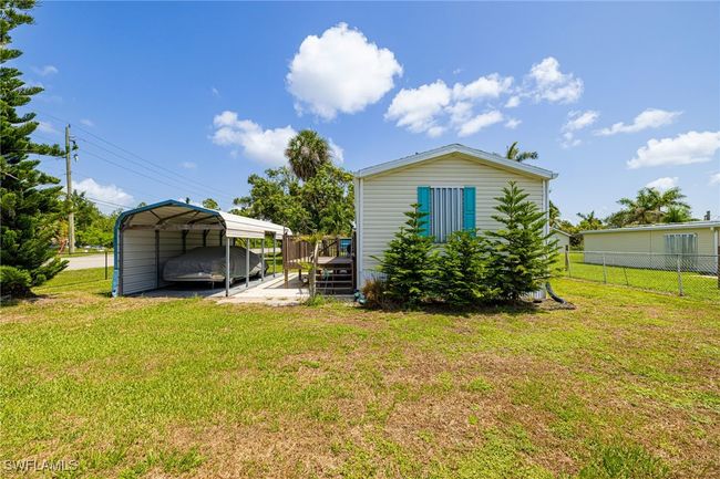 Back of property featuring a detached carport | Image 20