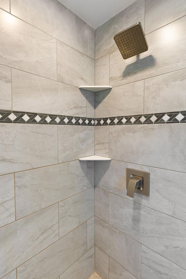 Beautiful tile in the shower. | Image 16