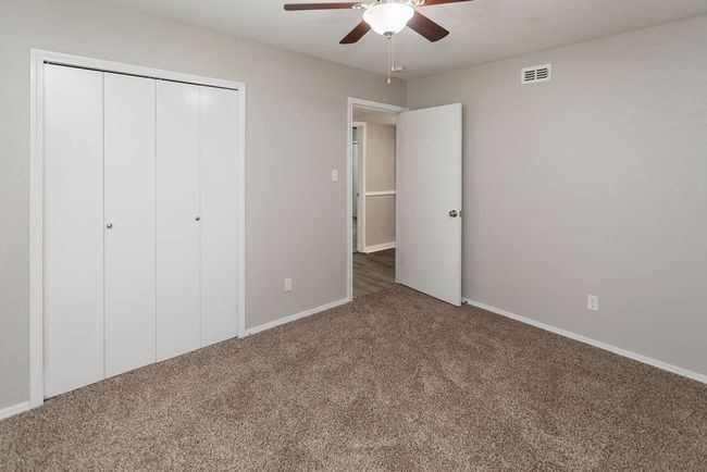 Half bathroom featuring vanity and wood finished floors | Image 23