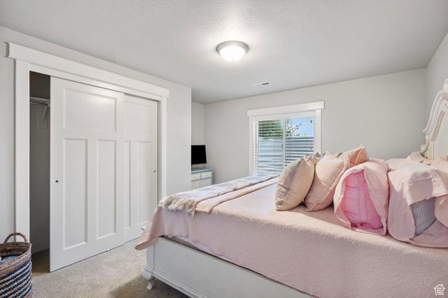 Bedroom with carpet and a closet | Image 30