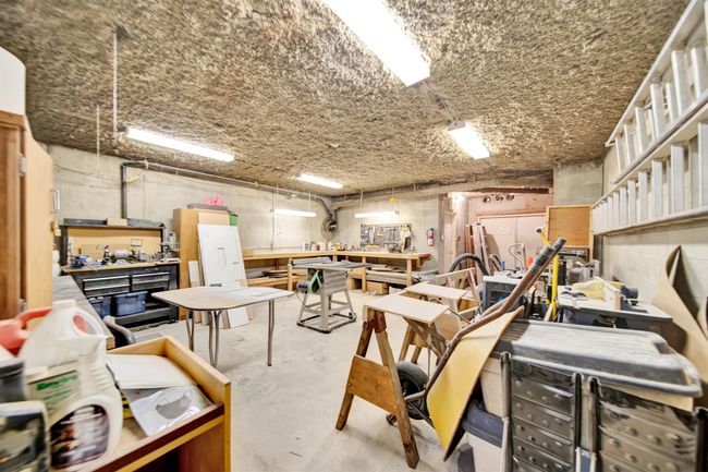 Exercise area featuring a paneled ceiling | Image 23
