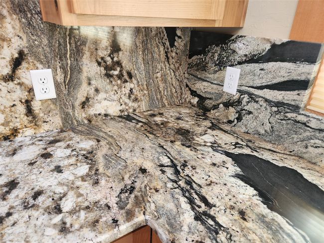 close up of granite counters | Image 21