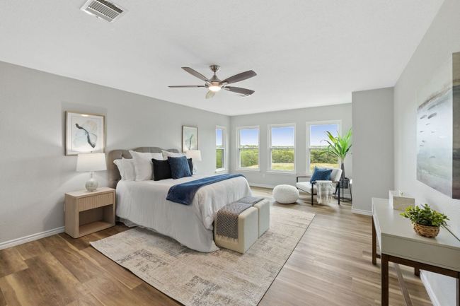 Bedroom featuring light wood finished floors, baseboards, and ceiling fan | Image 28