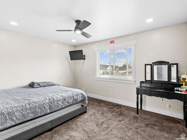 Bedroom with carpet flooring, baseboards, recessed lighting, and a ceiling fan | Image 11