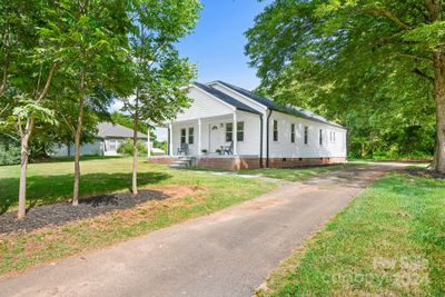 Transport yourself back in time to a slower pace of life with rocking chair front porches that invite everyone to gather and watch the sunset. Welcome Home | Image 1