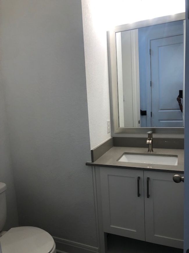 Half bathroom featuring vanity and a textured wall | Image 20