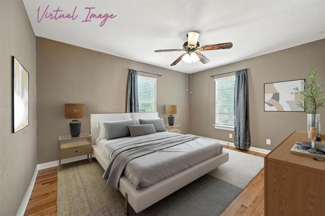 Empty room with wood finished floors, a ceiling fan, crown molding, and plenty of natural light | Image 17